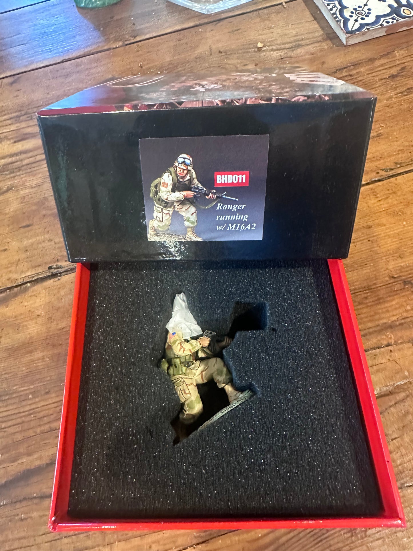 Crouching Ranger Moving Forward presented in a classic red collector's box.