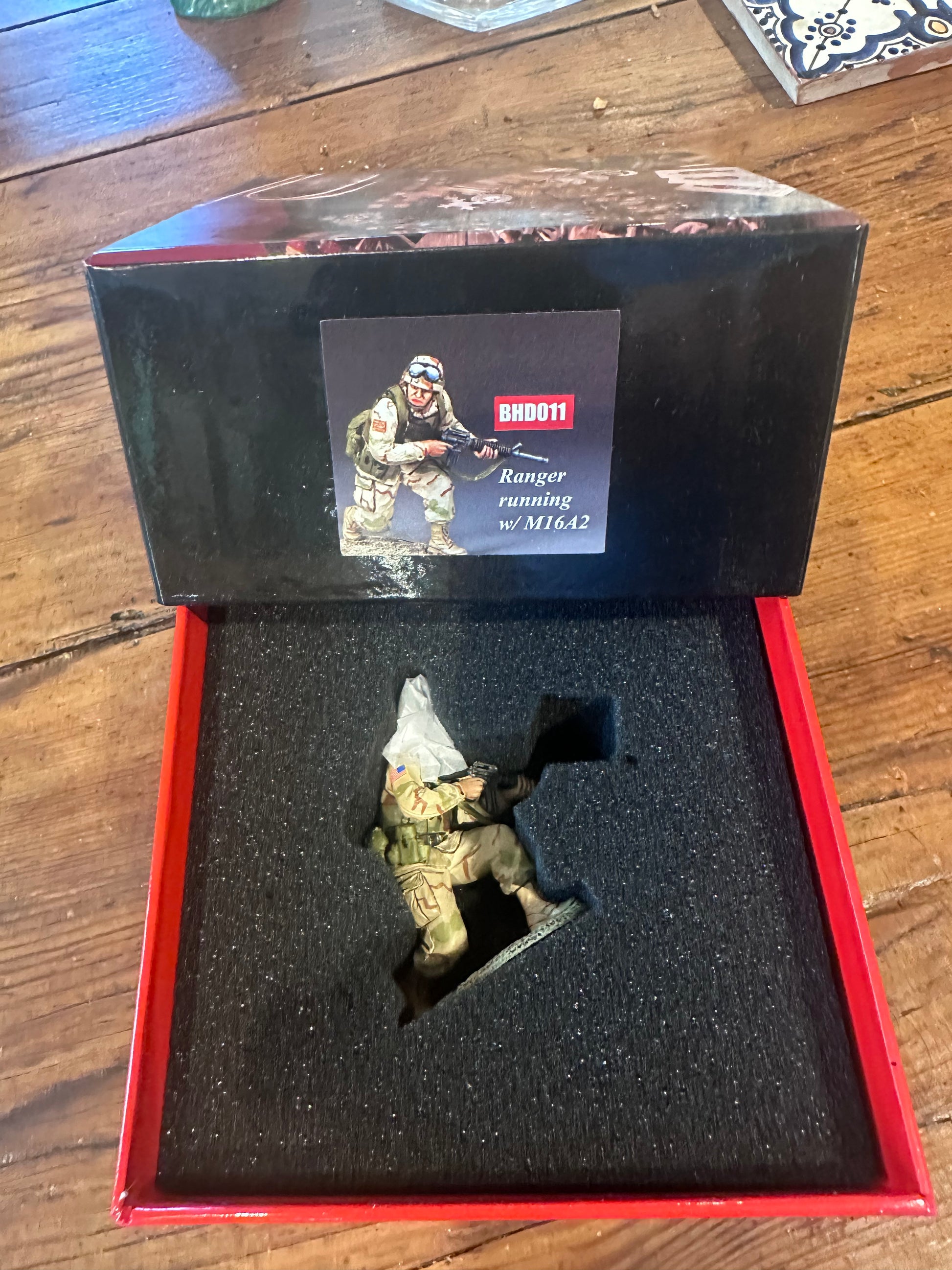 Crouching Ranger Moving Forward presented in a classic red collector's box.