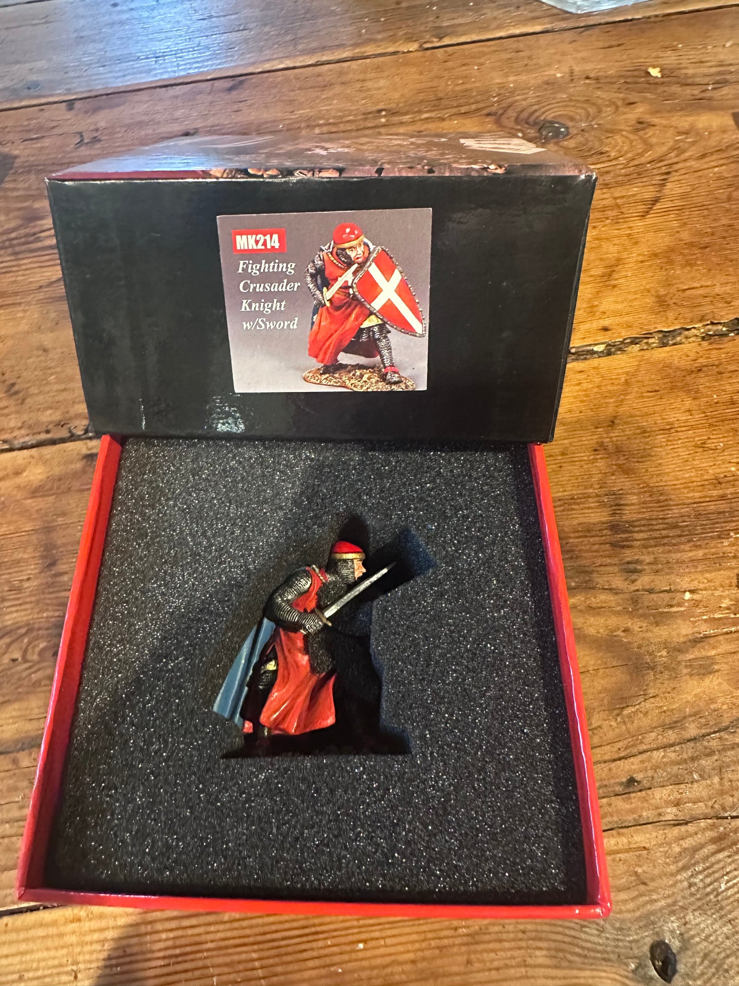 Crouching Crusader Knight with Sword presented in a classic red collector's box.