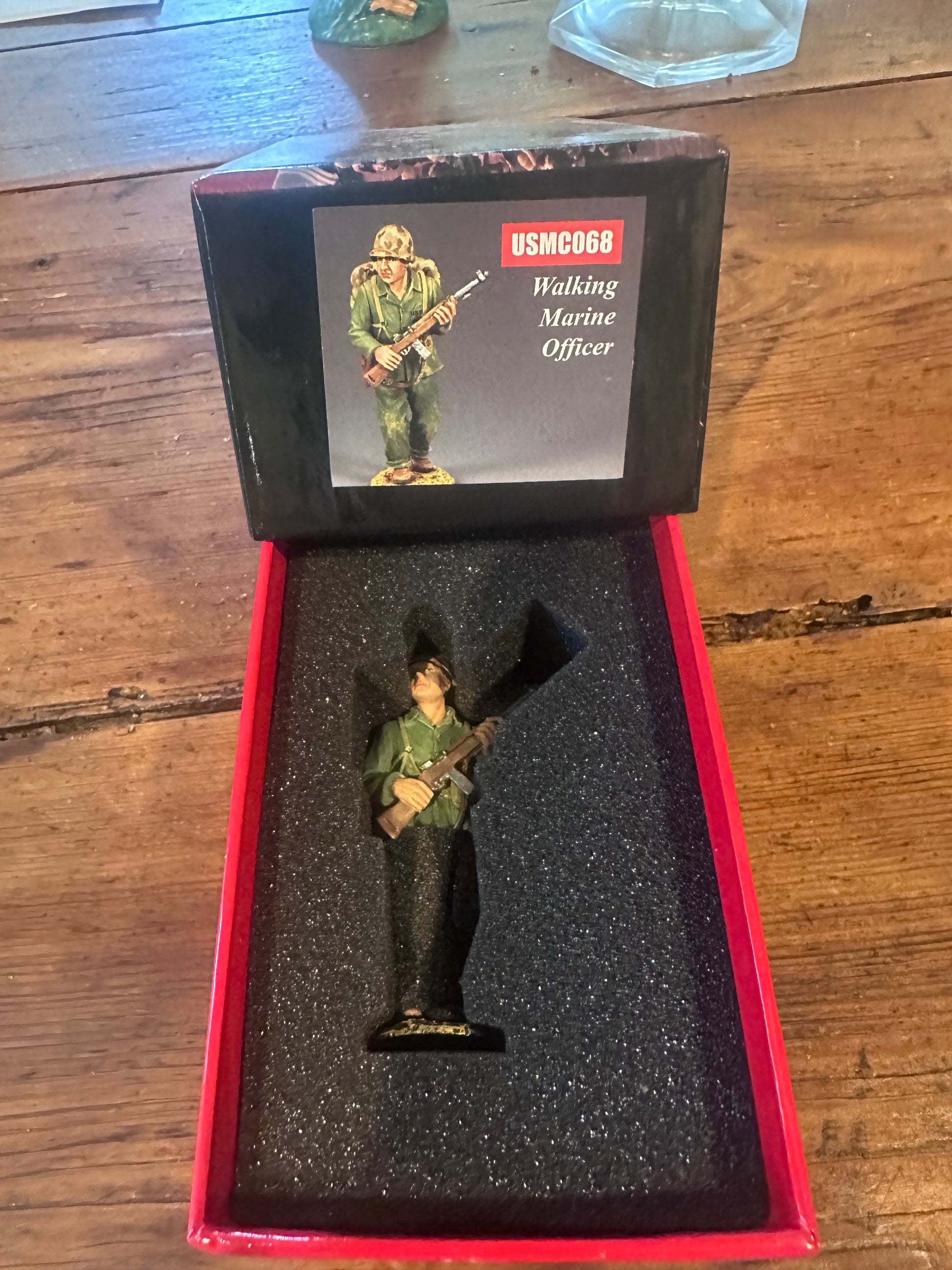 Walking Marine Officer presented in a classic red collectors box.