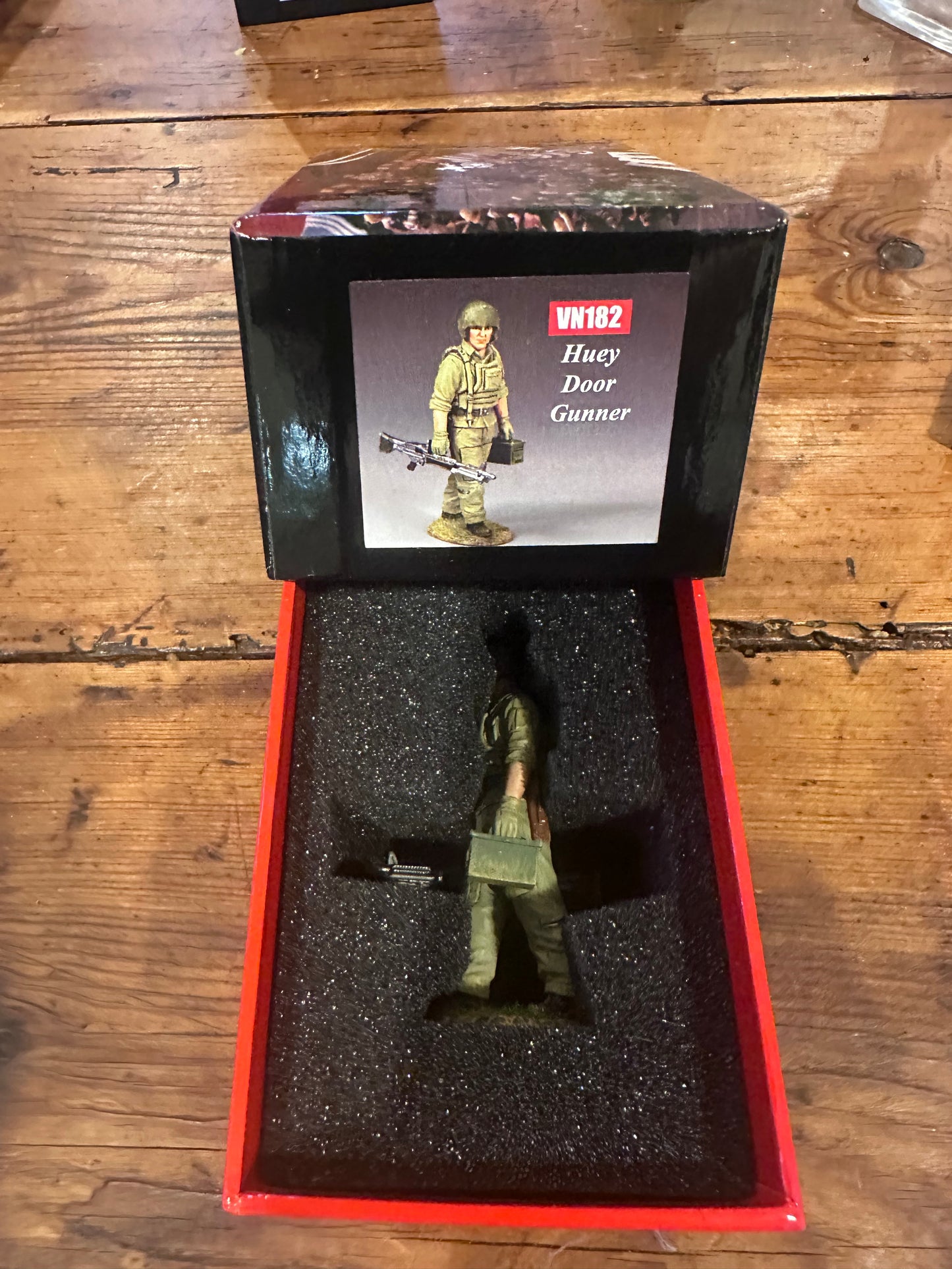 Huey Door Gunner presented in a classic red collector box.