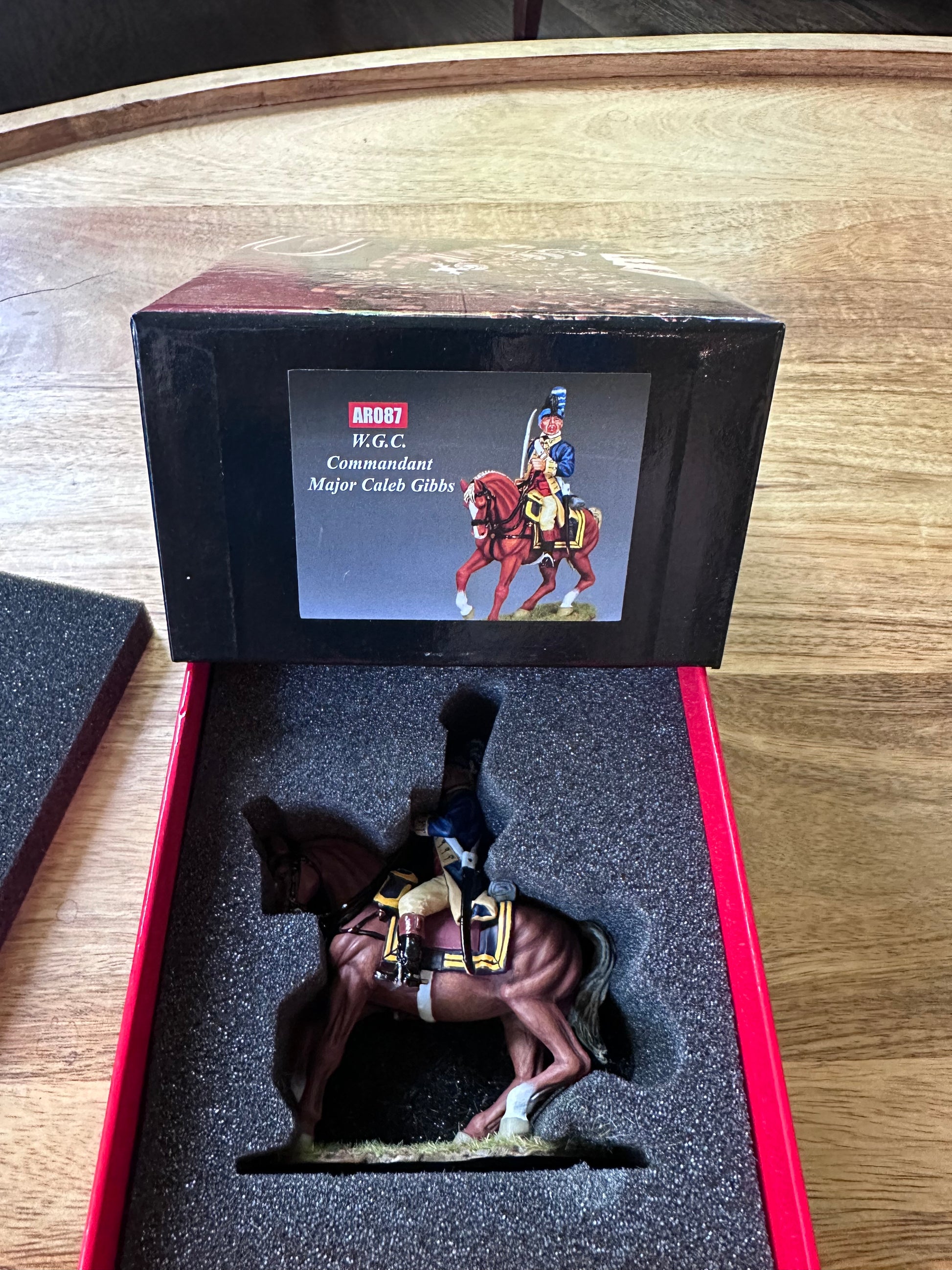 W.G.C. Commandant Major Caleb Gibbs package in a classic red collectors box.