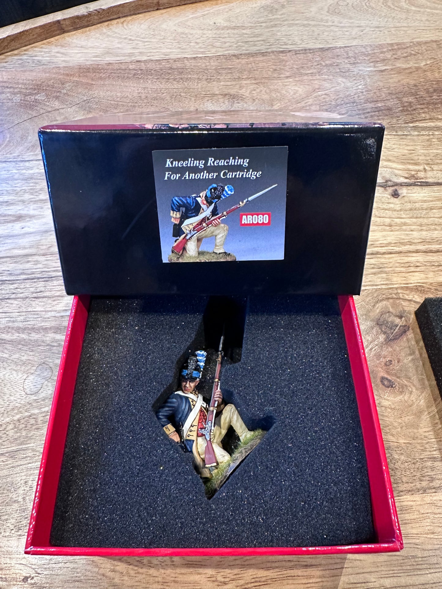W.G.C Kneeling Reaching for a Cartridge presented in a classic red collectors box.
