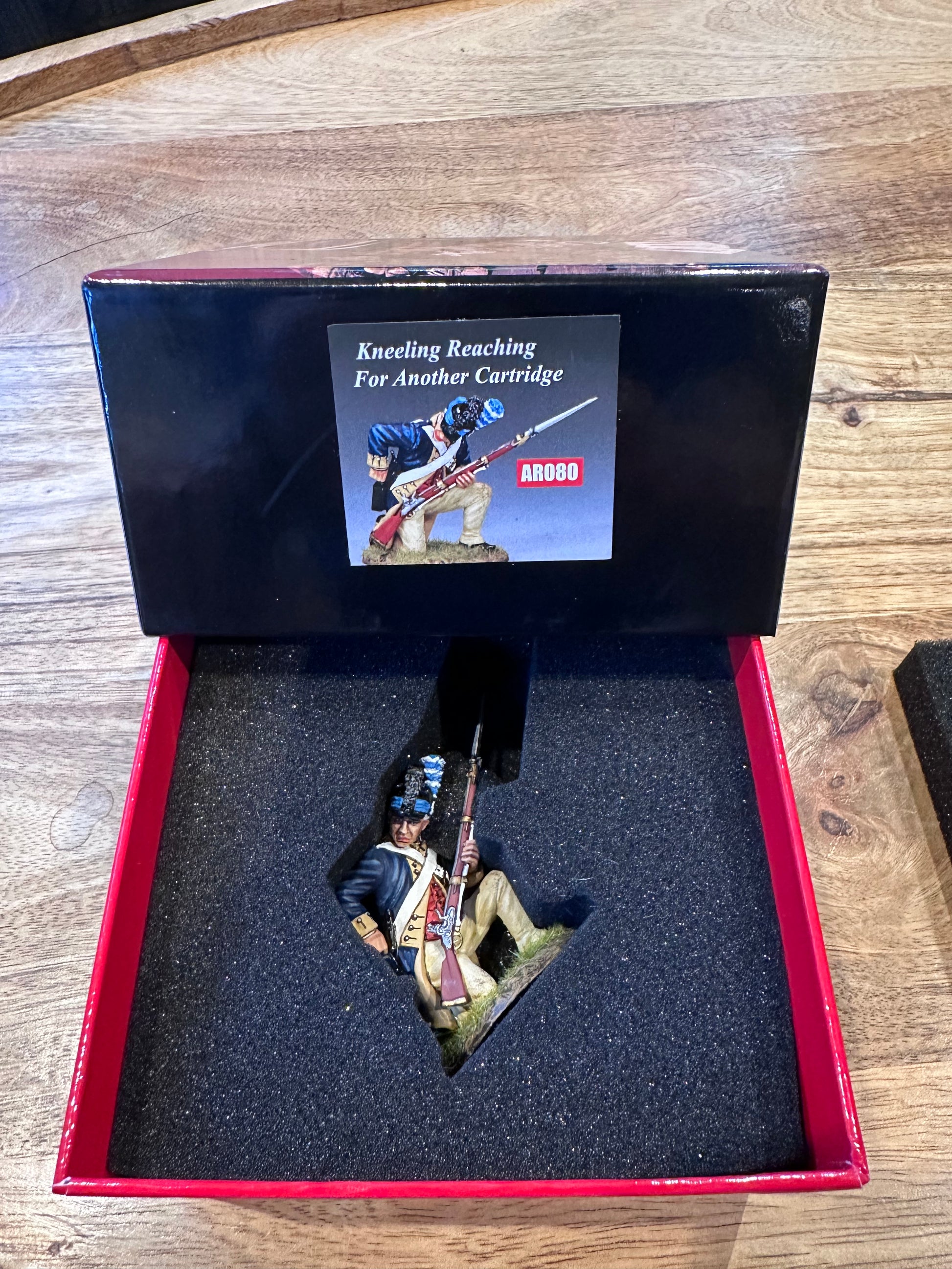 W.G.C Kneeling Reaching for a Cartridge presented in a classic red collectors box.