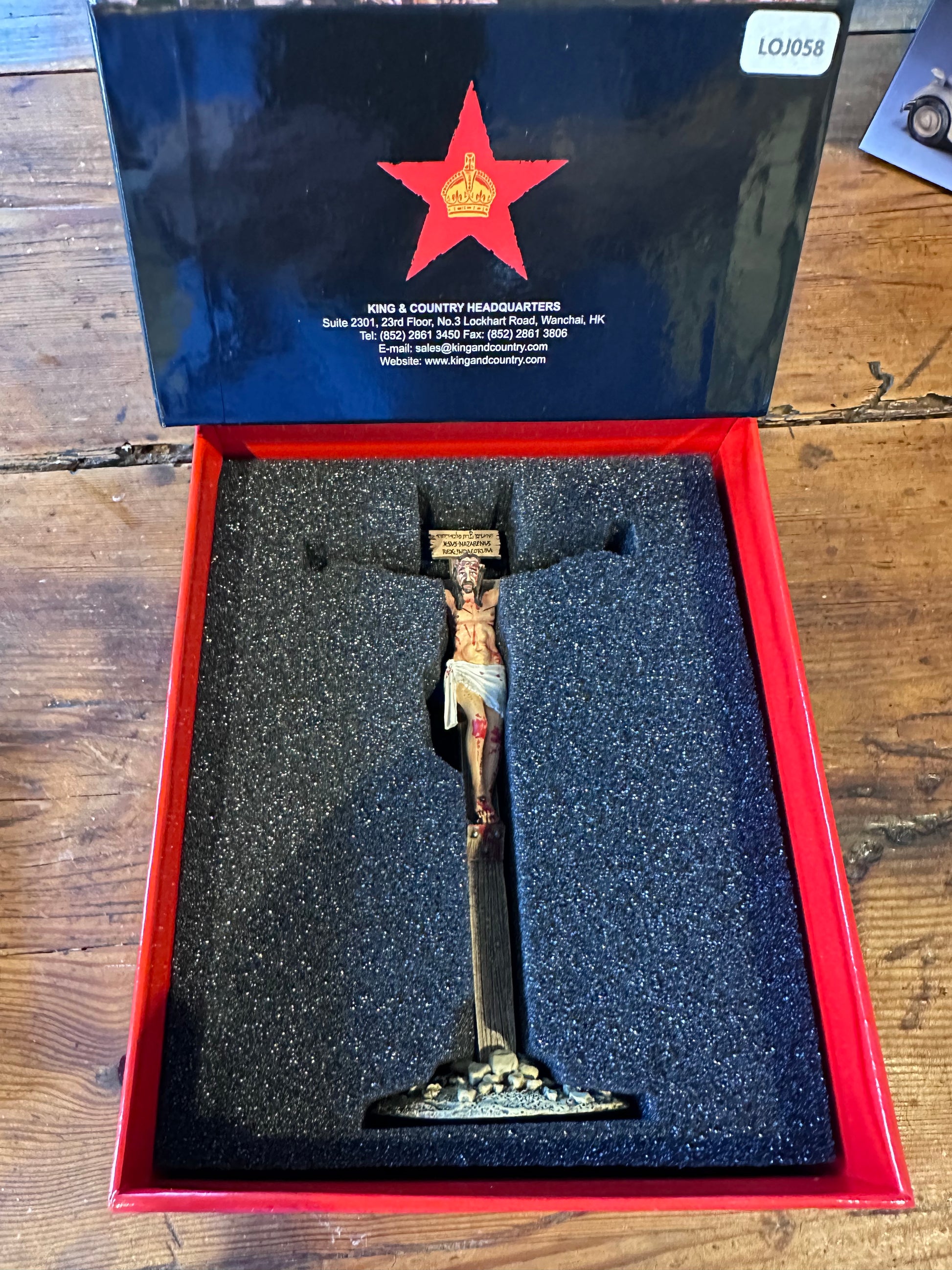 The Crucified Christ biblical figurine packaged in a classic red collectors box
