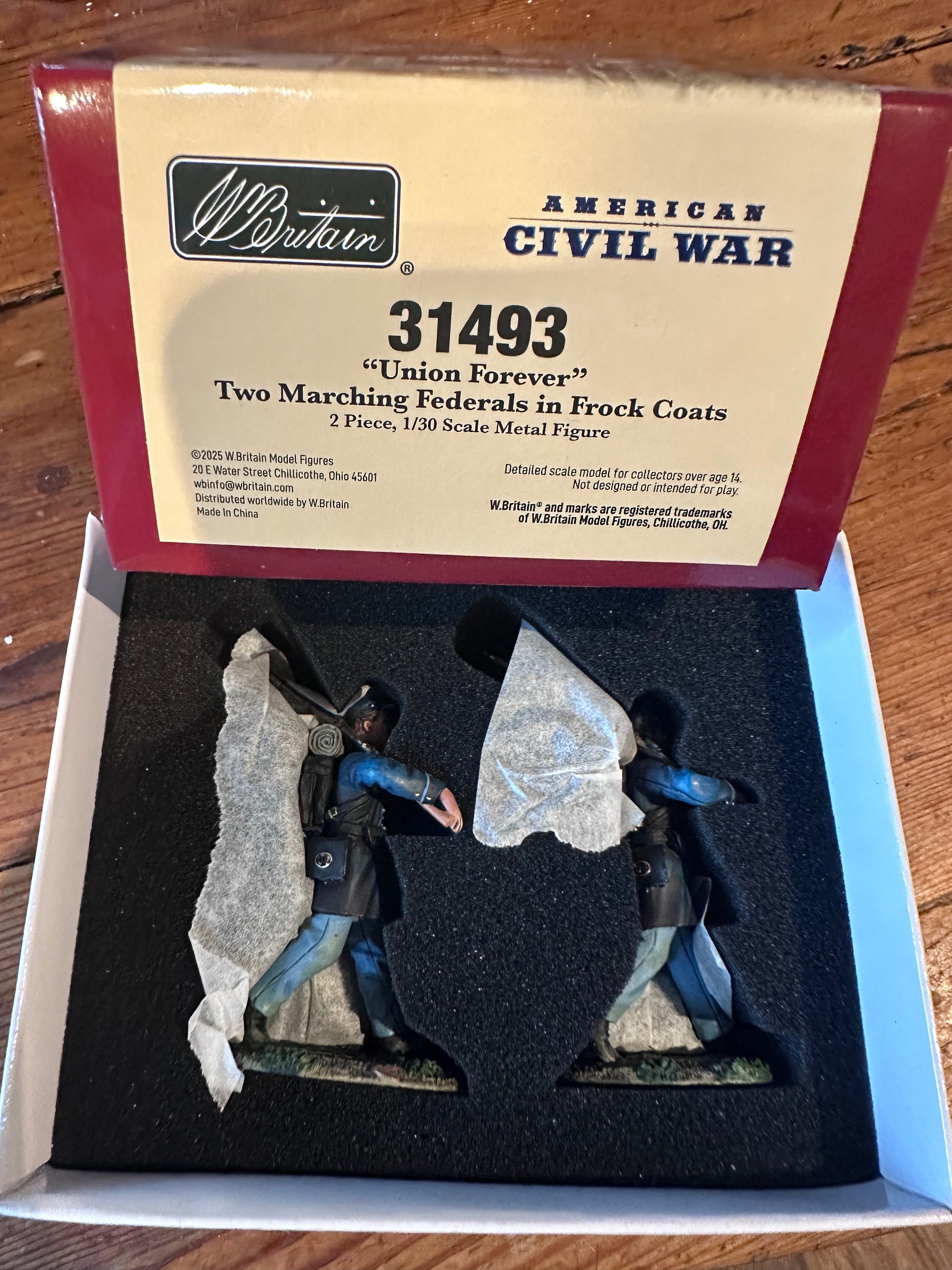 Civil War figure in a display box with packaging on a wooden surface