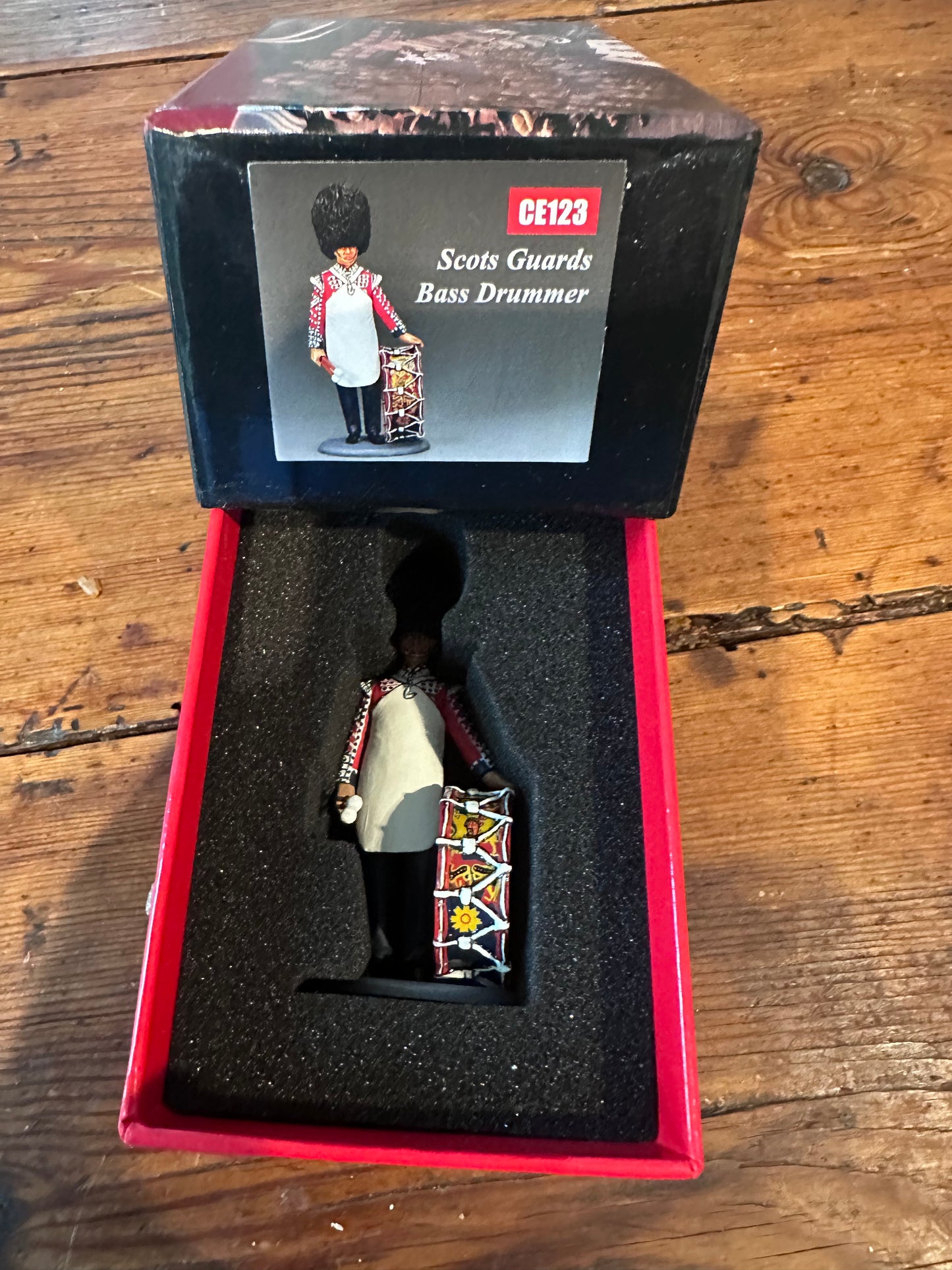CE123 Scots Guards Bass Drummer packaged in a classic red collector box.