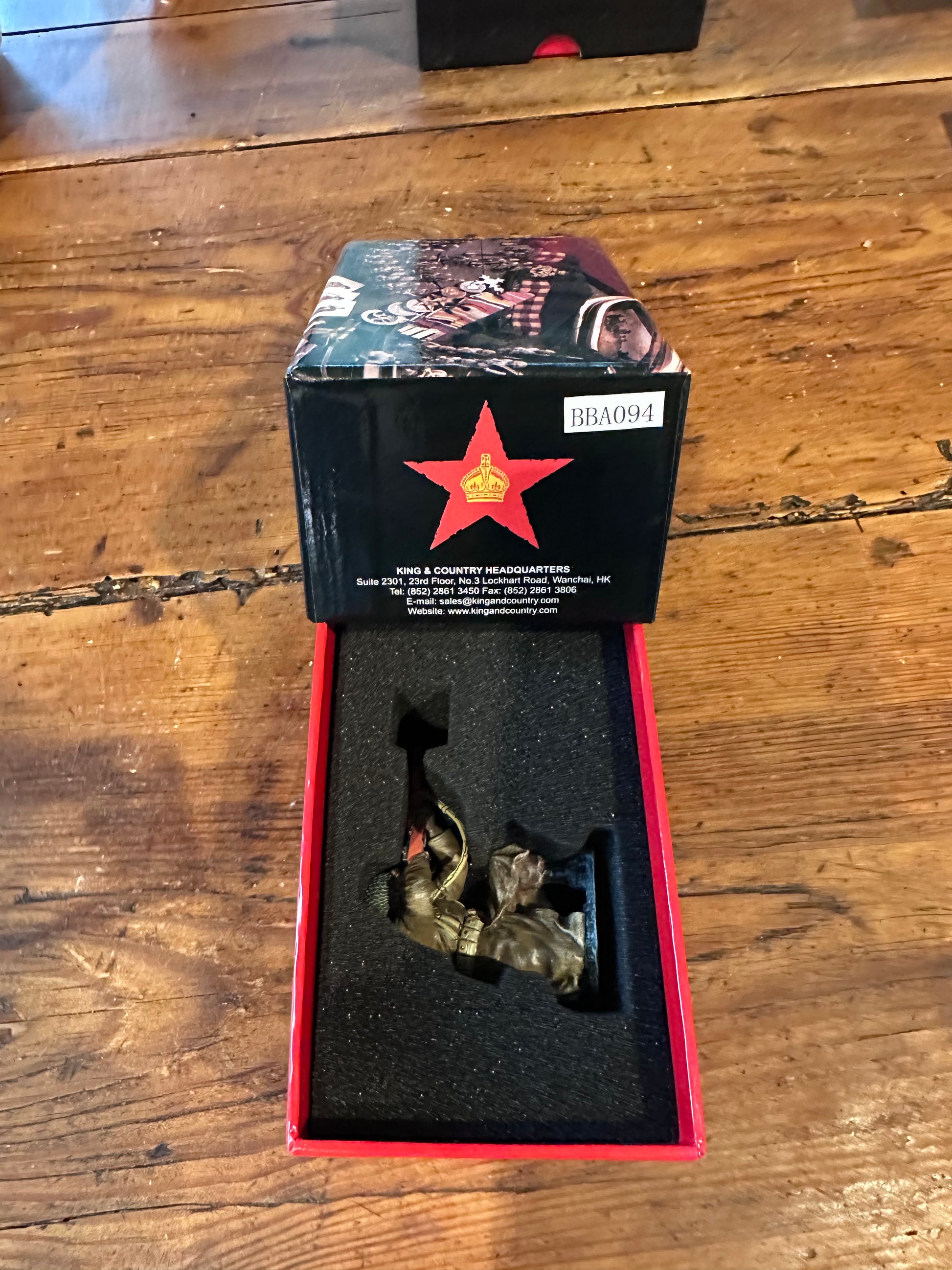 Packaging for King & Country BBA094 figure of a U.S. infantryman kneeling in the snow in a long winter overcoat, aiming his M1 Garand rifle.