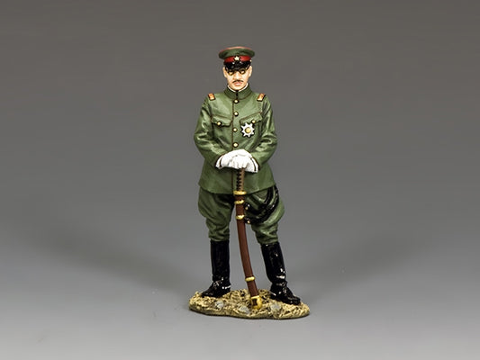 Figurine of a toy soldier military officer in green uniform with a gray background