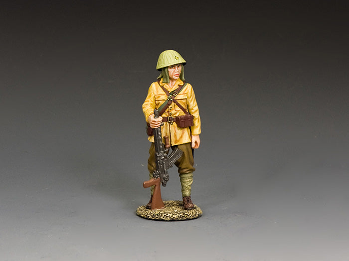 Japanese WWII toy soldier stands holding a Type 96 light machine gun, dressed in tropical uniform and steel helmet with neck flap.