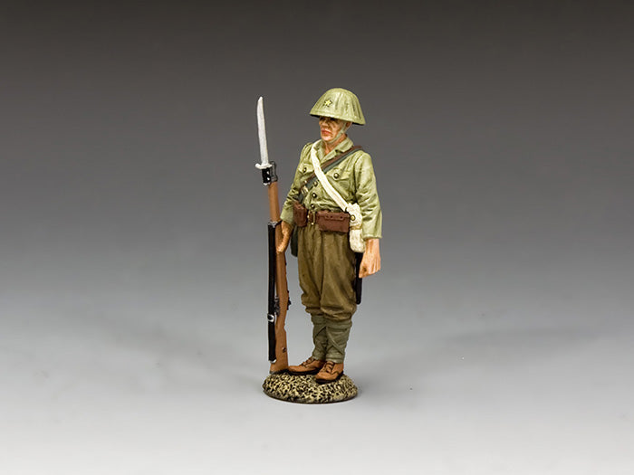 Toy Soldier Imperial Japanese Army soldier stands guard with Arisaka rifle and bayonet, wearing WWII uniform and steel helmet.