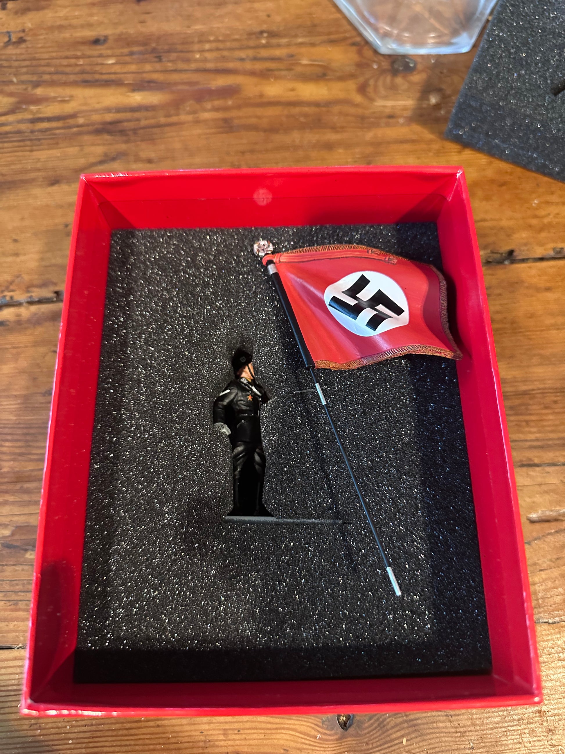 toy soldier Model of a flag with a swastika symbol in a classic collectors box.