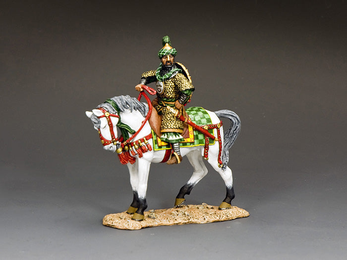 Saladin figure in ornate green and gold armor atop white Arab horse, capturing the noble Muslim leader’s grandeur and legacy.