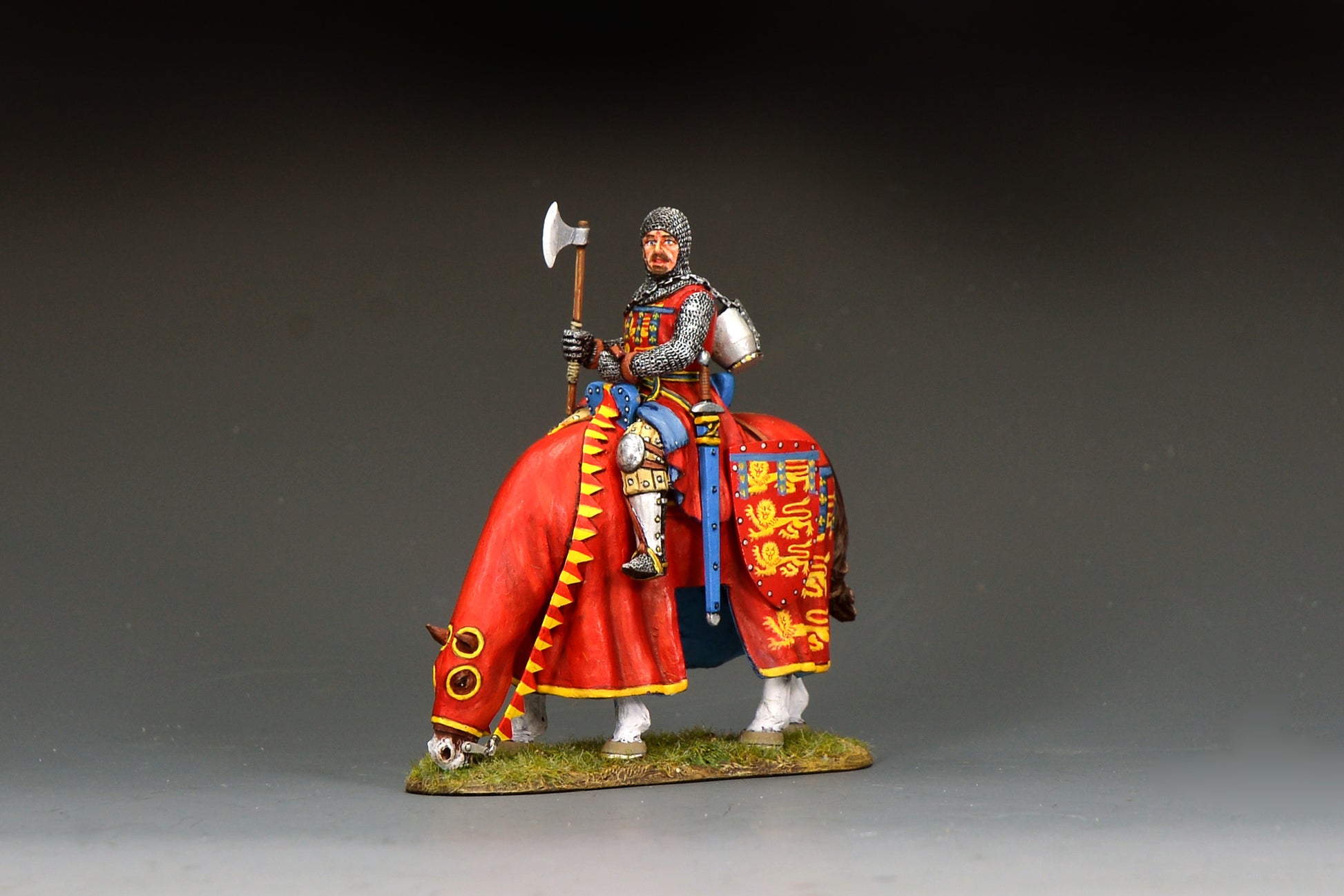 A painted miniature figurine of a knight in armor riding a horse, holding a large double-headed axe, set against a dark gray gradient background.