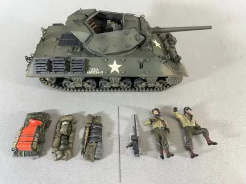 Model tank with accessories and figures on a white background