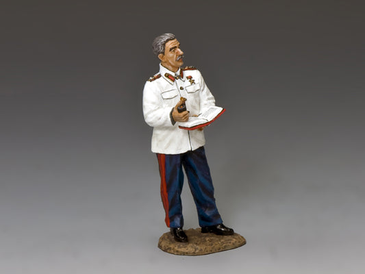 Figurine of a man in a white uniform with red and blue accents on a gray background