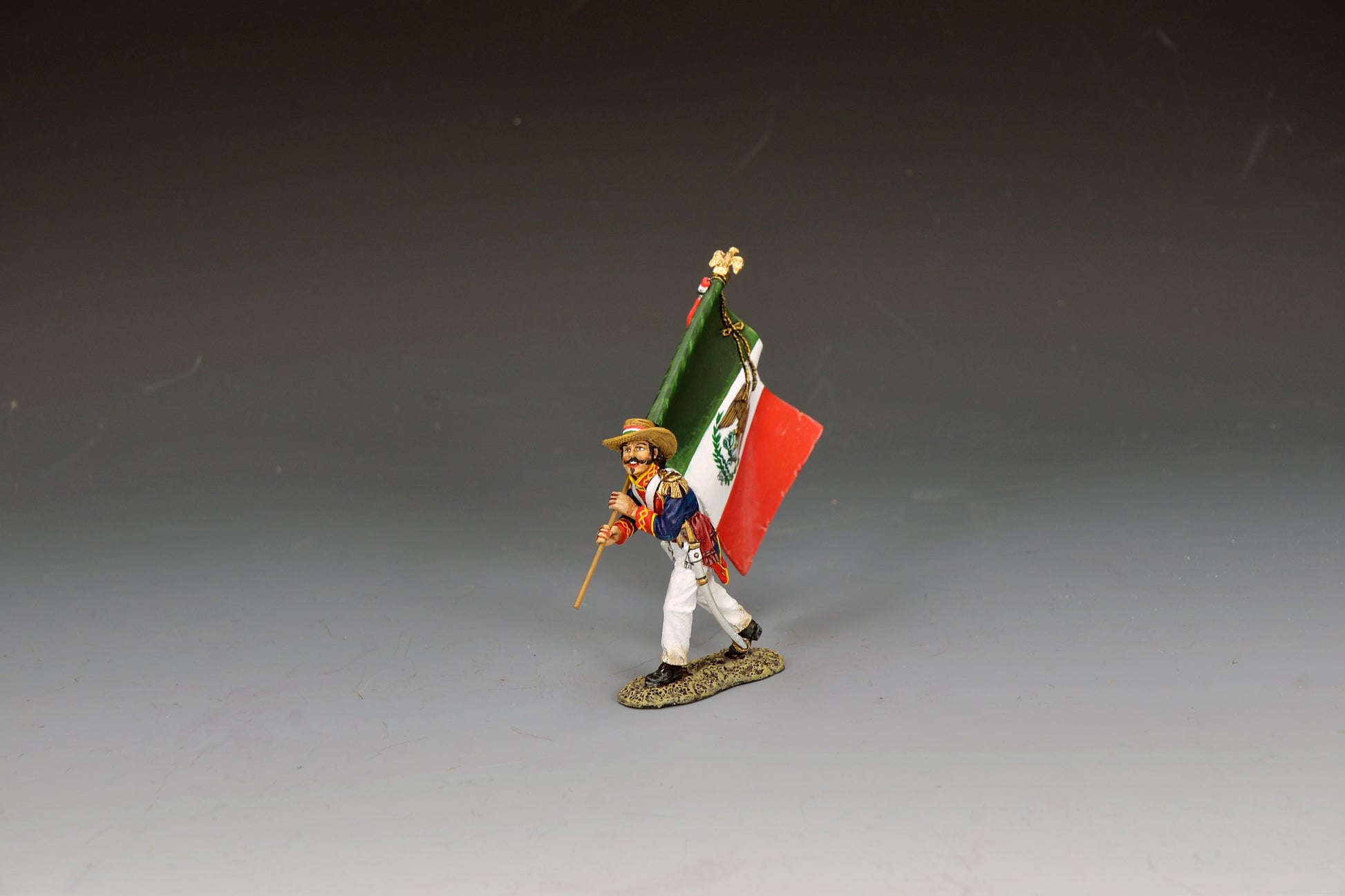 King & Country Mexican Army Flagbearer, young officer carrying green-white-red Mexican tricolor with eagle and serpent emblem, blue coatee with red facings and gold epaulettes, Alamo 1836, 1/30 60mm matte figure, RTA138
