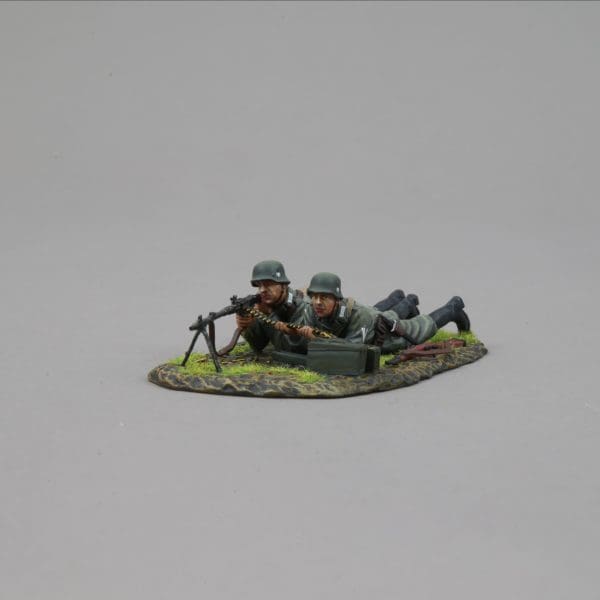 Collectible toy soldier miniature army men figurine HEER MG 34 Team. They are laying on the ground.