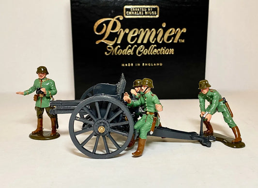 Collectible toy soldier miniature army men Four model soldiers in green uniforms operate a cannon in front of a "Premier Model Collection" box.