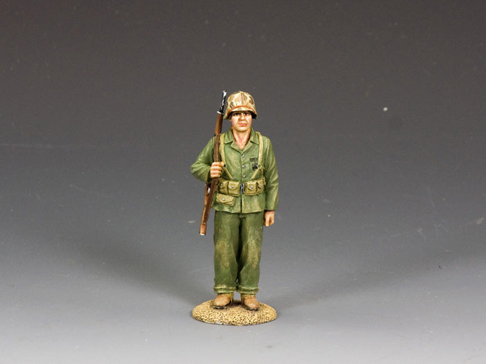 WWII U.S. Marine toy soldier standing at attention with shouldered M1 rifle. 1/30 scale, matte finish.