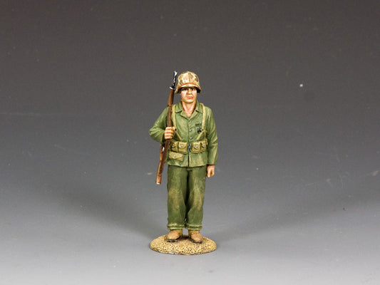 WWII U.S. Marine toy soldier standing at attention with shouldered M1 rifle. 1/30 scale, matte finish.