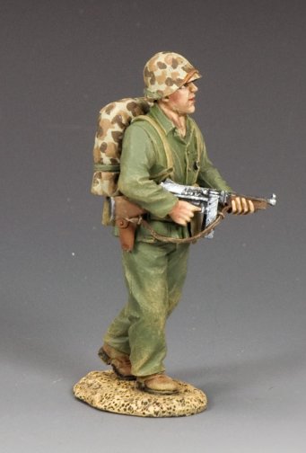 Toy soldier figure in military uniform with backpack and weapon on a gray background