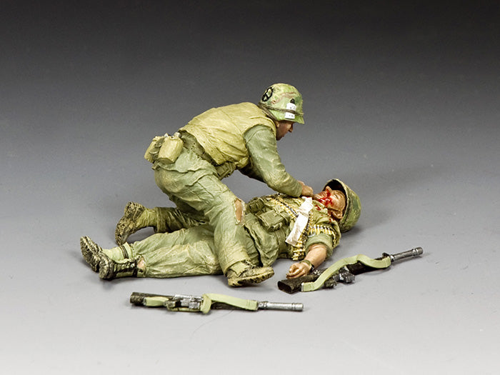 Vietnam War medic kneels over wounded Marine during Battle of Hue, inspired by Don McCullin's iconic 1968 photograph.