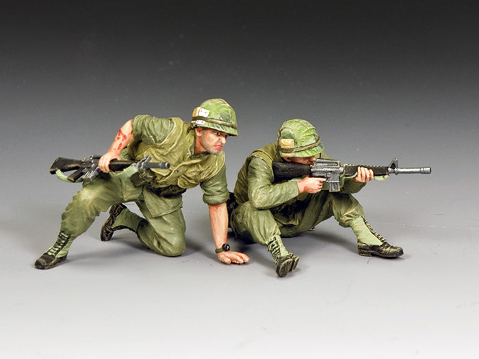 Vietnam War Marines in combat—one fires his M16 while the other, wounded, prepares to move. 1/30 scale matte toy soldier set.