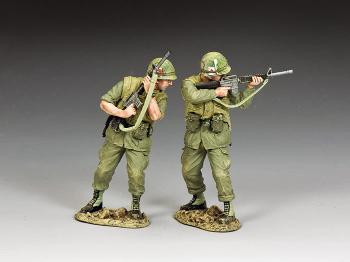 Two U.S. Marines cautiously advance with M16s raised, scanning for danger. 1/30 scale Vietnam War toy soldiers, matte finish.