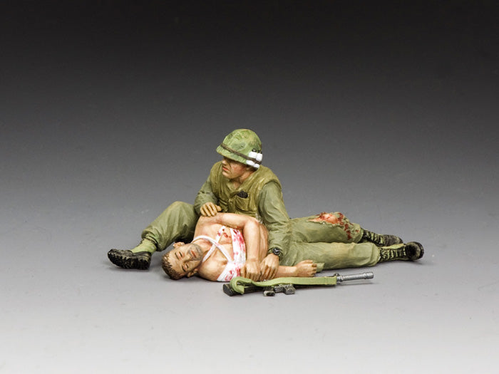 Vietnam War Marine cradles wounded comrade in emotional diorama scene inspired by TET Offensive photo. 1/30 scale, matte finish.