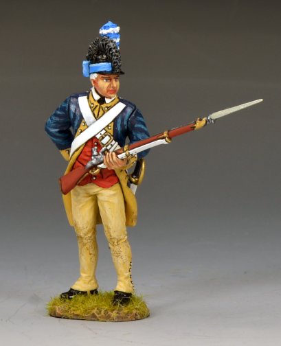 A painted figurine of a Revolutionary War soldier stands holding a musket with a bayonet. He wears a blue coat, tan pants, a red vest, a white crossbelt, and a black hat with a blue and white plume.