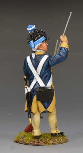 Model of a historical soldier in blue and yellow uniform with a sword, on a gray background