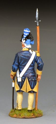 Model of a historical soldier in blue and yellow uniform with a spear on a gray background
