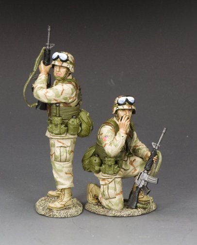 Two military miniature U.S. Army Rangers in desert camo—one kneels on radio, the other stands guard with rifle.