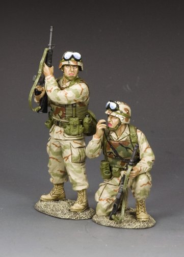 Two toy soldiers in camouflage uniforms on a gray background