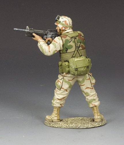 Military miniature U.S. Army Ranger aiming M16A2 with M203 grenade launcher in desert camo, mid-action.