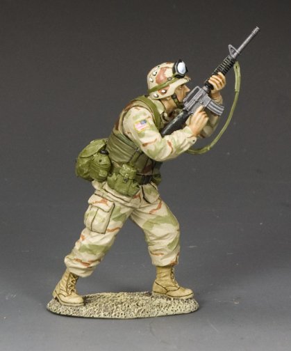 Ranger Firing Upwards with M16A2. Toy soldier figure in camouflage uniform with rifle on a gray background