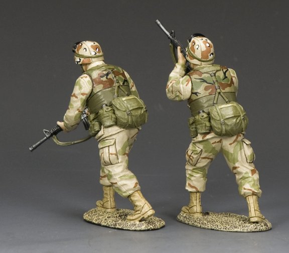 Ranger Advance to Contact. Two toy soldiers in camouflage uniforms with weapons on a gray background