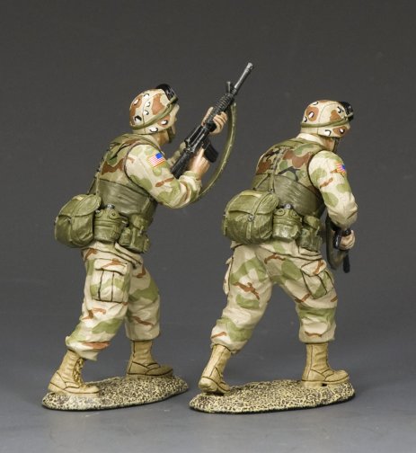Ranger Advance to Contact. Two toy soldiers in camouflage uniforms with rifles on a gray background