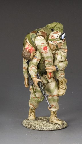 No Man Left Behind. U.S. Ranger toy soldier carries wounded comrade in fireman’s carry while gripping M16A2.
