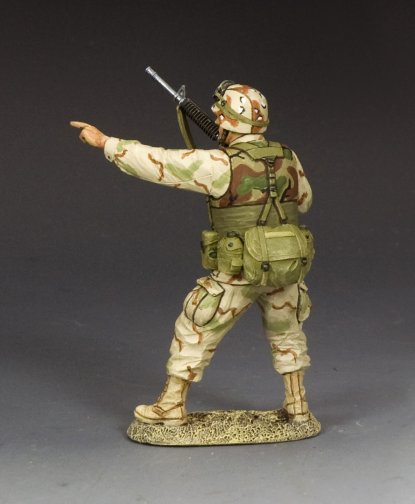 Desert-uniformed Ranger NCO military miniature points and shouts commands while holding M16A2.