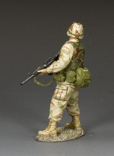 Ranger Covering the Rear. Toy soldier figure in camouflage uniform with backpack and rifle on a gray background