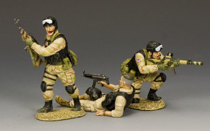 Three Delta Force figures from the Super Six Four rescue: one kneeling, one standing, and pilot Mike Durant seated with MP5K. Rear view.