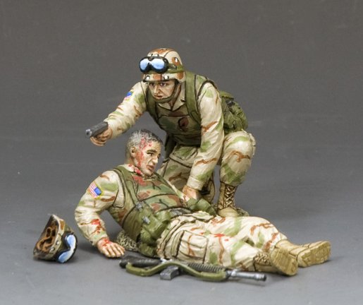 Two military miniature soldiers in military gear on a gray background