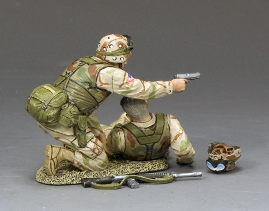 Two toy soldiers in military uniforms with weapons on a gray background. One soldier is injured.