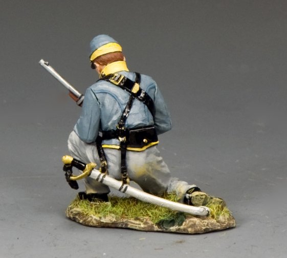 Military miniature Model of a soldier in uniform with weapons on a gray background