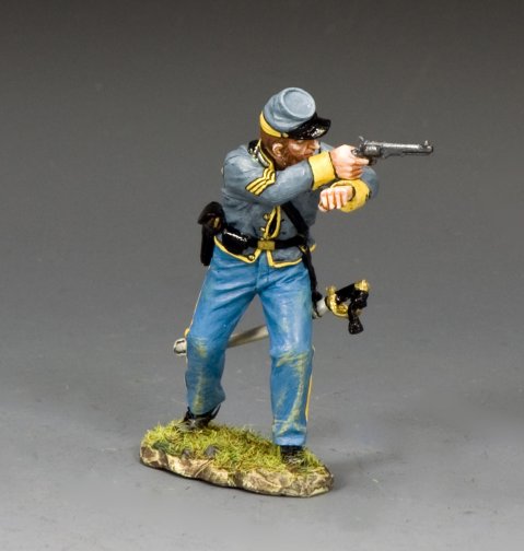 Military miniature in Civil War uniform aiming a rifle on a gray background
