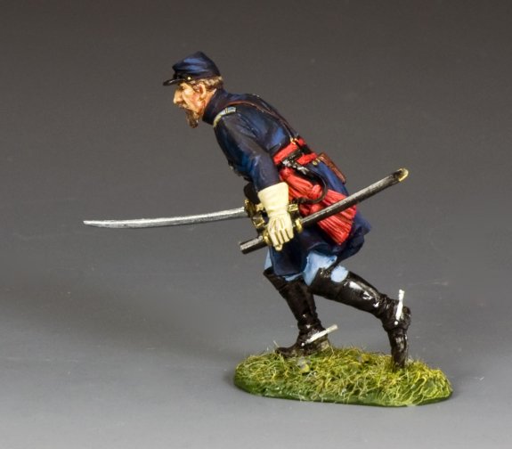 Model figure of a soldier in historical military attire with a sword on a gray background
