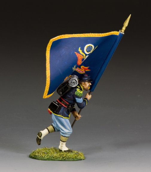 Model toy soldier figure of a soldier holding a flag with intricate design on a gray background