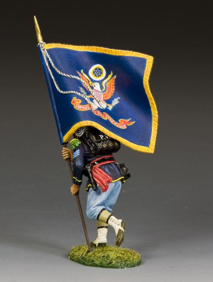 Model figure holding a flag with an eagle emblem on a gray background